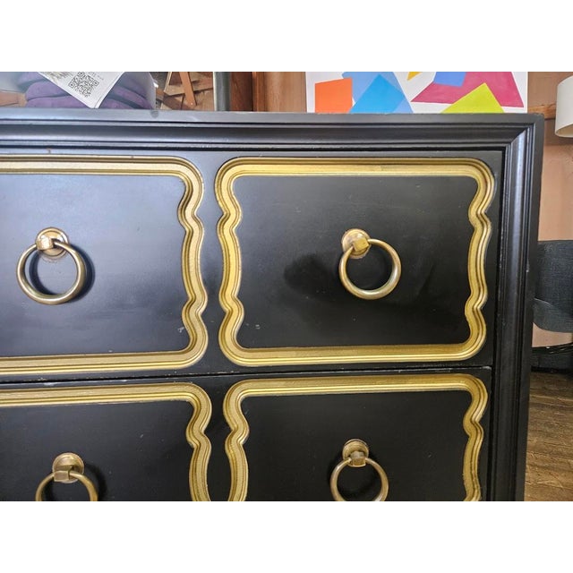Dorothy Draper Espana Style Dresser, Hollywood Regency. This gold and black 3-drawer dresser with gold ring pulls is in...