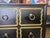 Dorothy Draper Espana Style Dresser, Hollywood Regency. This gold and black 3-drawer dresser with gold ring pulls is in...