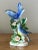 Celebrate the beauty of nature with this dynamic vintage ceramic bird figurine. This captivating piece features a stunning...