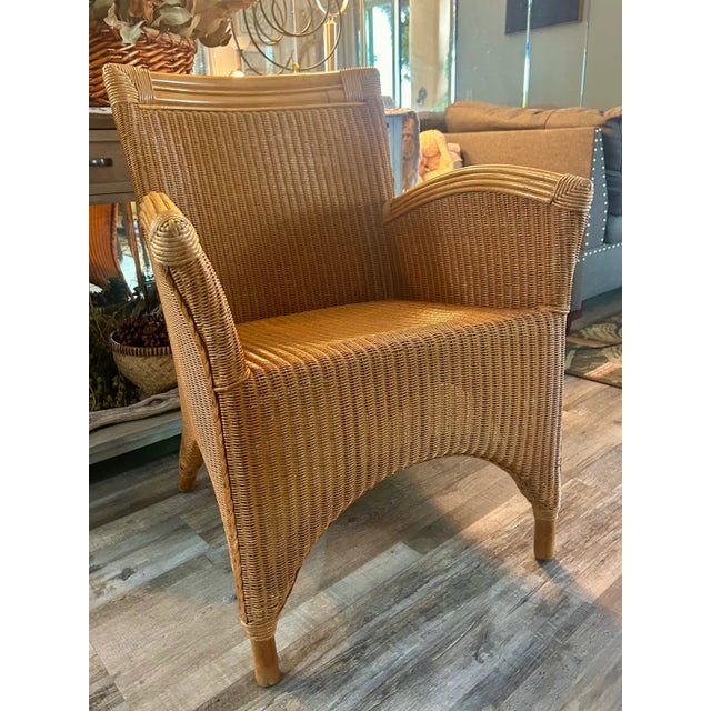 This is a stunning and rare vintage Palecek wicker and rattan armchair, a true testament to the company's renowned...