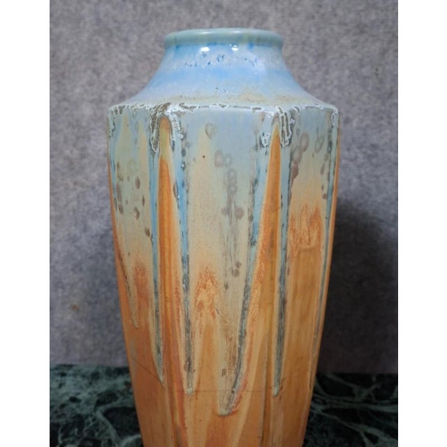 Pair of glazed ceramic vases, 20th century work, in an Art Deco style with clean, elegant lines. with a slightly curved...