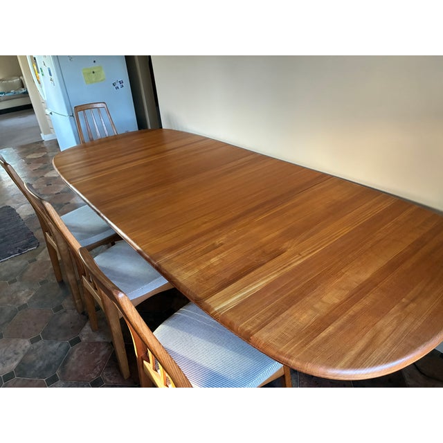 Benny Linden Design Teak Dining set. Gear drive slides with in-table leaf storage. 2 leaves, 8 chairs. Made in Thailand...