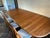 Benny Linden Design Teak Dining set. Gear drive slides with in-table leaf storage. 2 leaves, 8 chairs. Made in Thailand...