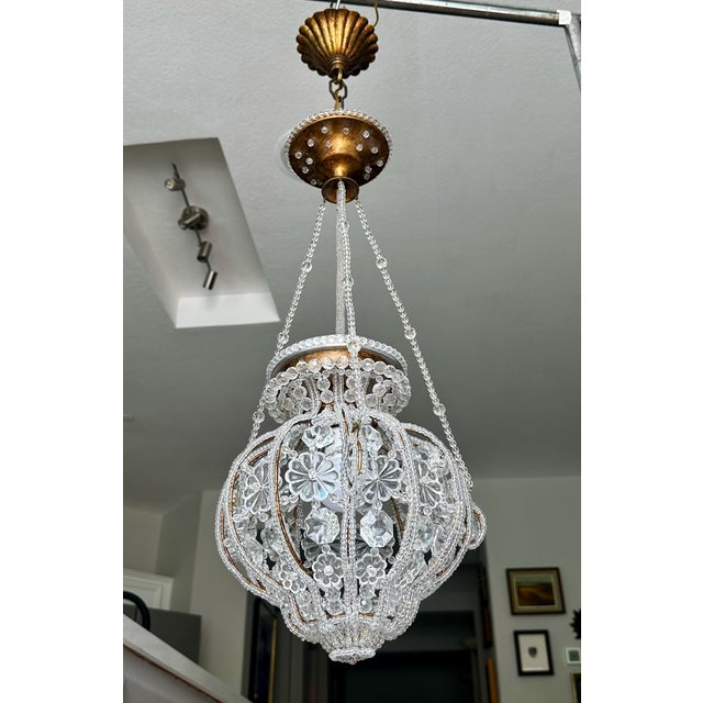 An exquisite vintage crystal-beaded basket pendant lantern chandelier by legendary luxury designer Sherle Wagner...