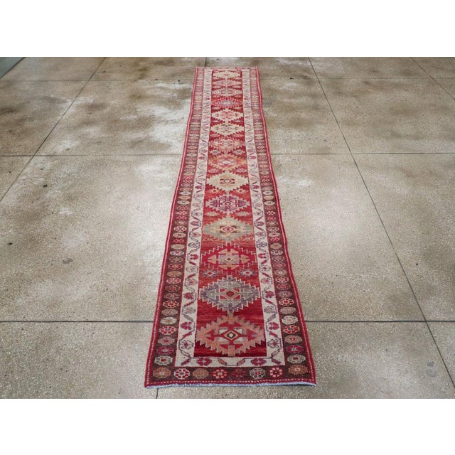 A vintage Turkish Anatolian tribal runner handmade during the mid-20th century. Measures: 2' 8" x 13' 8"