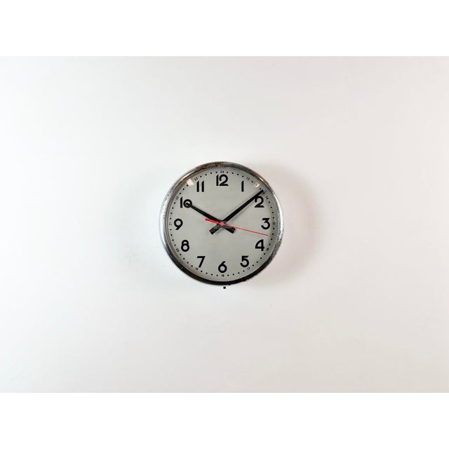 Vintage wall clock manufactured by PAL Hodkovive nad Mohelkou in former Chechoslovakia in 1950s. It features a metal...