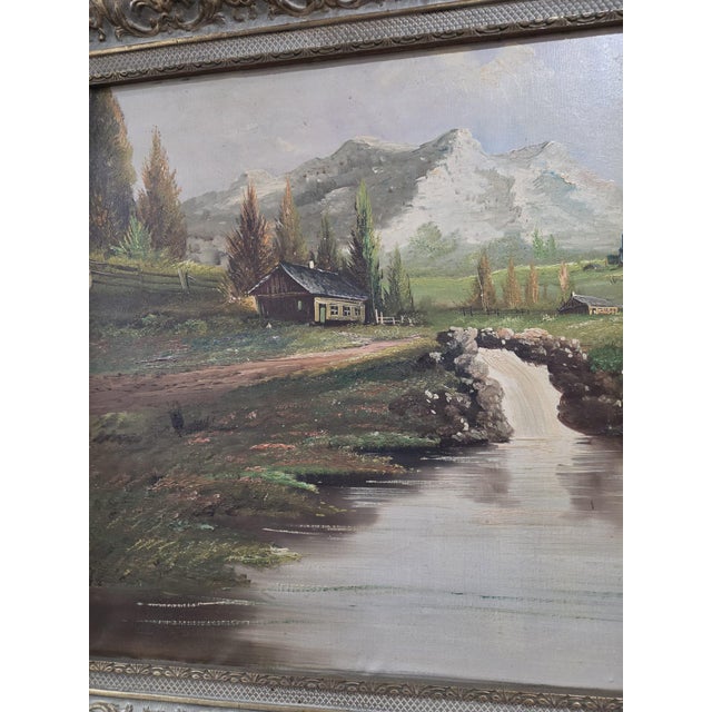 This large vintage European landscape oil painting showcases a beautiful and intricate depiction of a scenic europe...