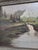 This large vintage European landscape oil painting showcases a beautiful and intricate depiction of a scenic europe...
