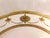 This is a white Minton plate with gold encrusted trim at the verge and on the outer band and rim. It has a pale duck...