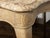 A French Rococo beech wood console table from the 18th century with variegated marble top, natural patina, serpentine...