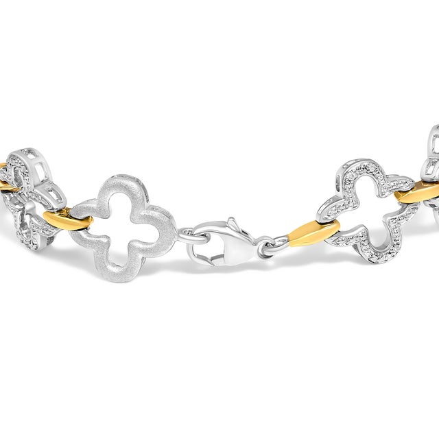 Experience the refined allure of this .925 two-tone sterling silver tennis bracelet, where craftsmanship meets a modern...
