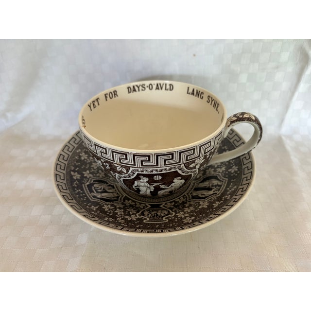 An extra large Copeland Spode cup and saucer in the Greek pattern. The cup and saucer feature a distinct brown transfer...