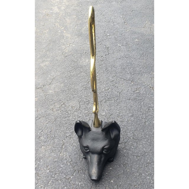 A stylish Edwardian design Brass and Iron Door Stop with Fox Head and Riding Crop in great vintage condition. Measures...