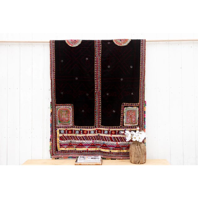 A captivating vintage Rabari throw, directly sourced from Gujarat, India, is a unique piece that tells a story. Hand-woven...