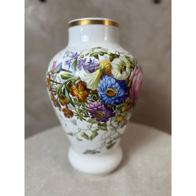 An elegant pair of Paris porcelain vases dating from the mid-19th century, circa 1850. Delicate hand-painted floral...
