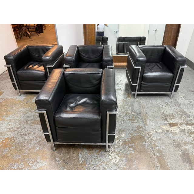 Design Plus Gallery presents a Set of Four Le Corbusier Style Cube Lounge Chairs. Executed in the International Style,...