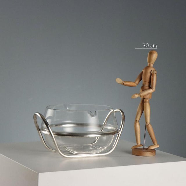 Glass bowl with spouts set in a tubular silver-plated metal frame with handles for table service. Brand name engraved...