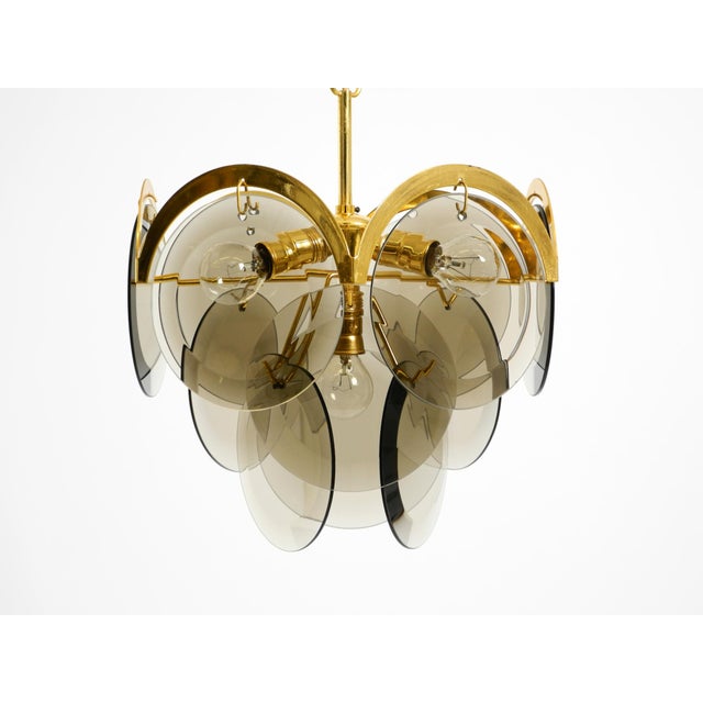 Beautiful original 1960s brass chandelier with 12 large gray smoked glass disk shades. great space-age design. Made in...