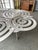 Large Contemporary Creation spiral stainless steel coffee cocktail low table by the italian designer artist Antonio...