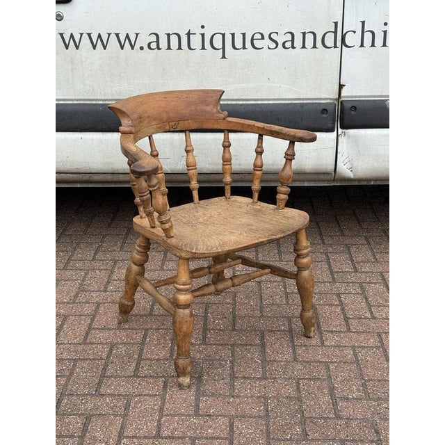 Antique Smokers Bow Fireside Chair. Sizes :- 79 cms tall, 69 cms wide, 45 cms seat height. Obviously an antique item, so...