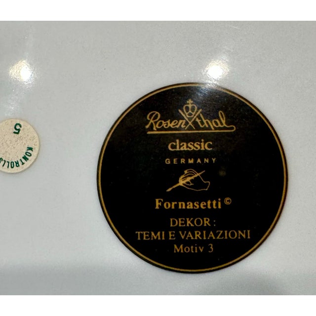 Lovely black and white Fornasetti plate rimmed in gold. Unused decorative plate. Made in Germany