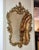 This elegant French Baroque style wall mirror features a richly detailed gold leaf frame with beautifully hand-carved...
