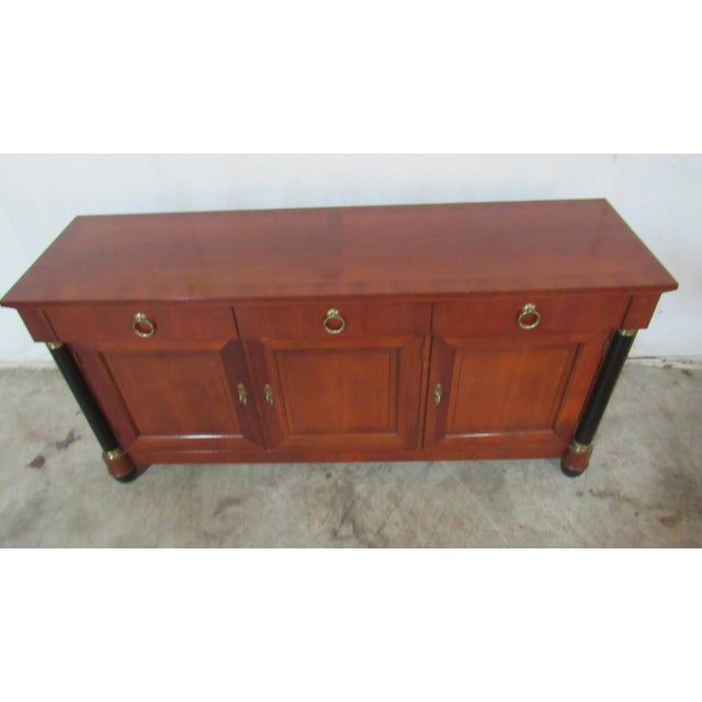​Item: Baker Sideboard Details: Empire Style Nice Hardware Traditional Design Signed Baker Cherry Measurements: 66" long,...