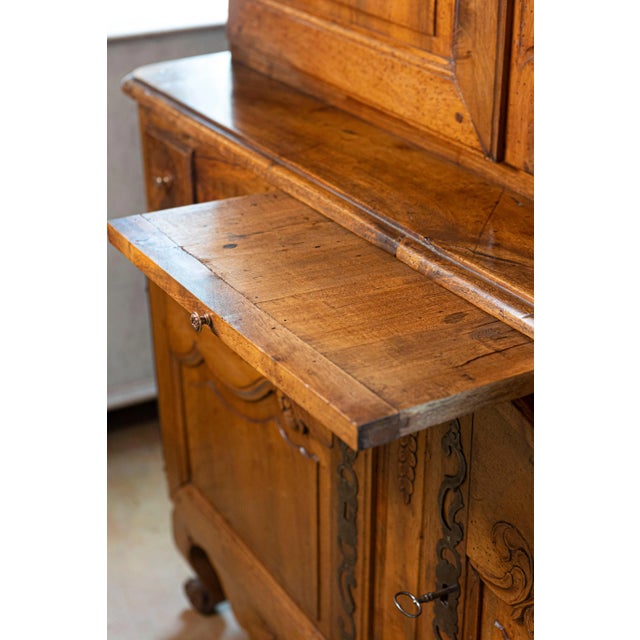 A French Louis XV period mid-18th century walnut buffet à deux-corps from the Loire Valley with bonnet top. Born in the...