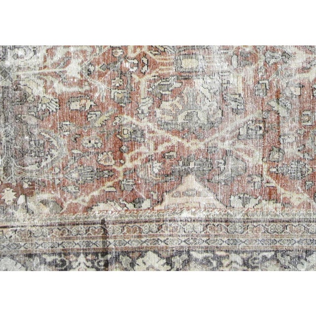 1960s Persian Mahal Carpet. Hand woven in the Mahal region of Iran. Distressed and refinished in the U.S. The Persian...