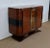 Superb showcase buffet from the 1930s in horizontal veneers. This furniture with curved shapes has two doors opening by...