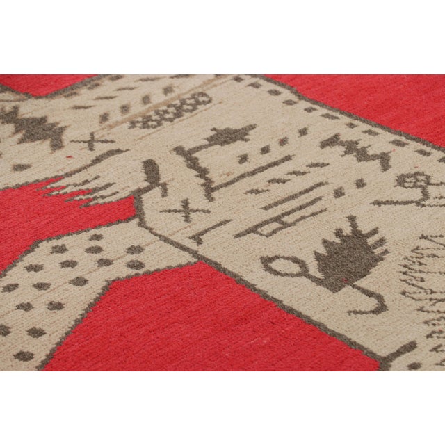 Made with hand-knotted wool and originating from East Turkestan circa 1930-50, this 4x7 Samarkand rug is an exciting entry...