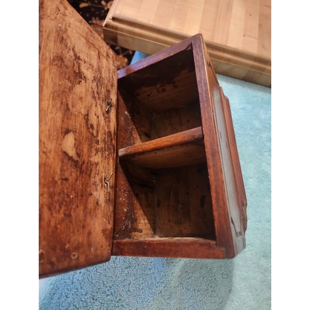 Vintage carved wood salt box two sections and a wire hinged box top and carved wood back.