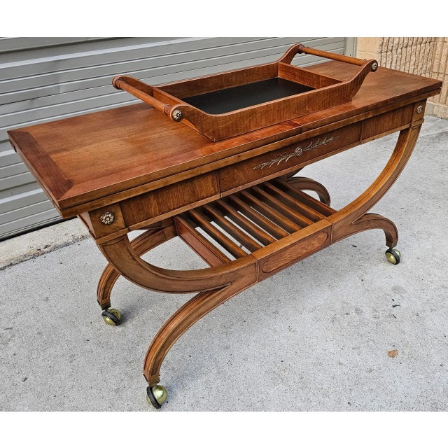 This Hollywood Regency Thomasville Server is a captivating piece that is both functional and elegant, with its lustrous...