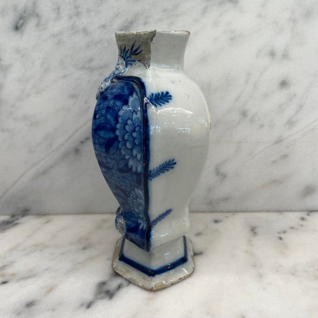 Early Dutch Delft blue and white vase from the Netherlands, featuring a sculptural shaped body with a richly decorated...