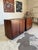 Pair of mid century modern Brazilian rosewood filing cabinets, featuring built-in shelving, two small drawers in each and...