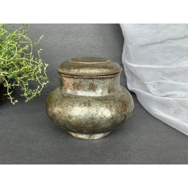Hand wrought from sturdy metal, this antique container has a fabulous patina of age and a rustic look. The old rustic...