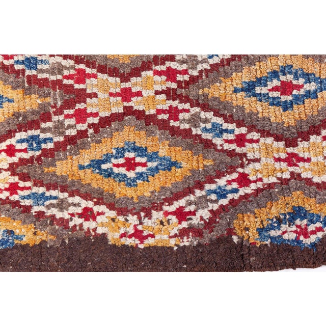 Vintage Moroccan Rug Size: 6'2" × 8'4" (187 × 254 cm) This vintage Moroccan rug features a richly patterned lattice of...