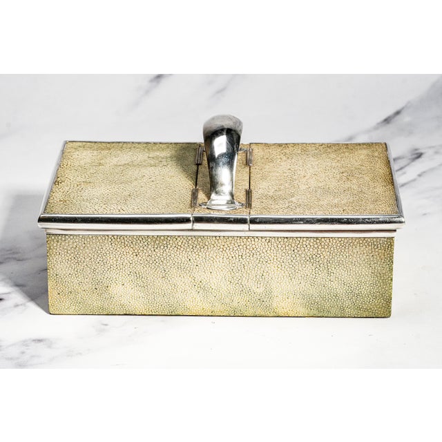 An exceptionally handsome and rare antique English shagreen leather and sterling silver cigar box. Combining luxurious...
