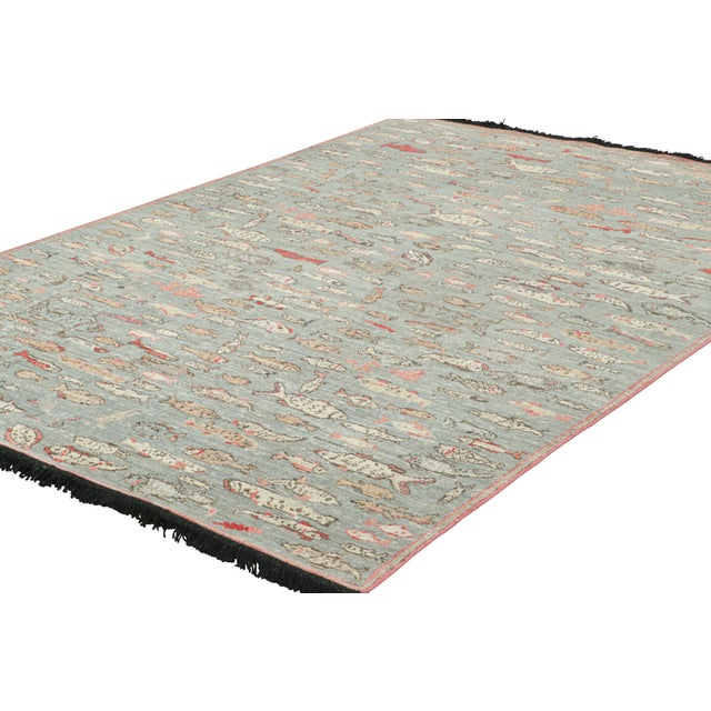 Made with hand-knotted Ghazni wool, this 6x9 rug from Rug & Kilim’s Burano collection features schools of stylized fish...