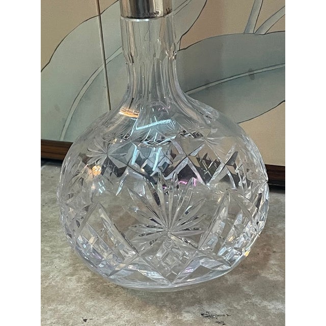 This stunning German decanter features a beautifully crafted clear cut crystal glass body, paired with an elegant 800...