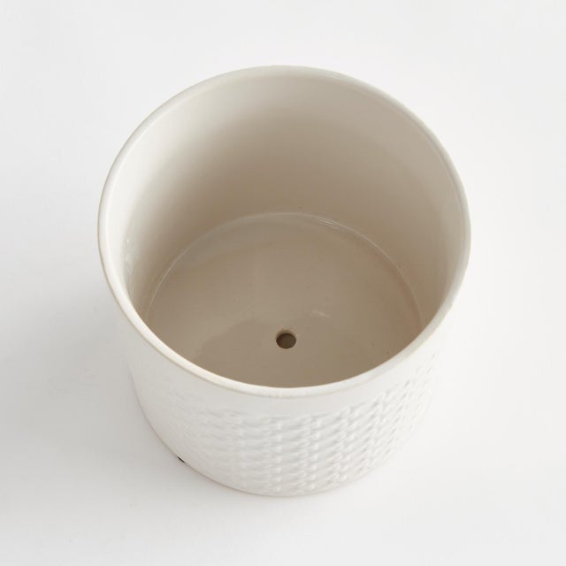 This clean,White cachepot is made in traditional style. With unmistakable chinoiserieinspired lattice details, it is sure...