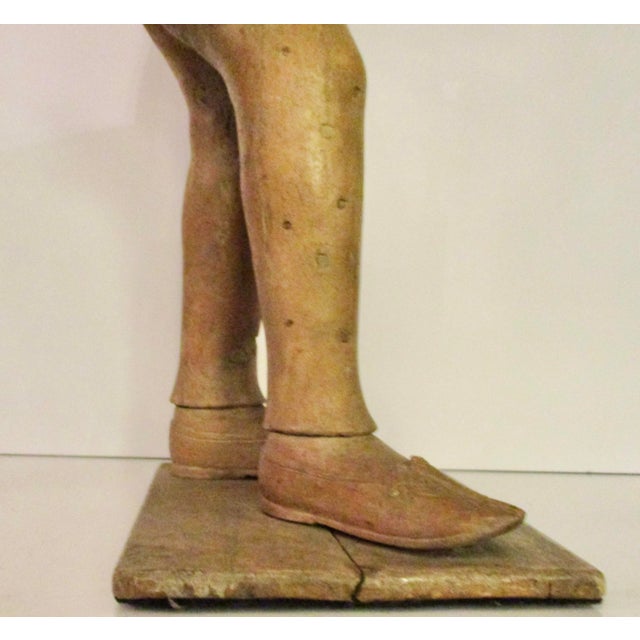 Wooden carving of a Turkish Merchant, mounted on a wooden plinth of the same wood. Late 19th-century manufacture. Possibly...