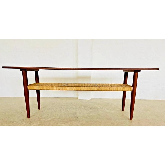 A beautifully proportioned vintage Danish Mid-Century Modern coffee table, dating from circa 1960s and combining richly...