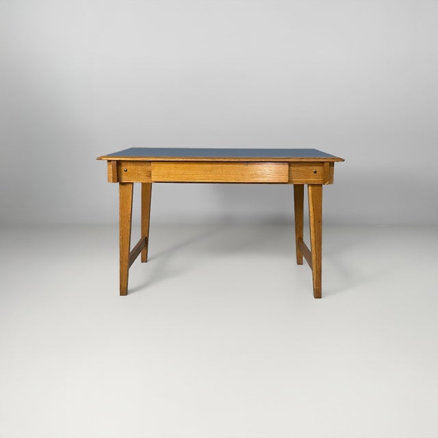 Italian mid-century modern desk in blue laminate and wood, 1960s Desk with a rectangular light blue Formica top, four-leg...