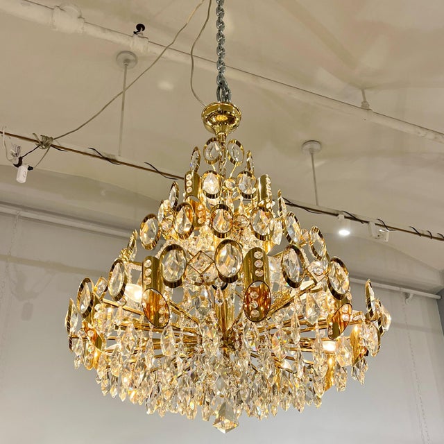 Decorative Polished brass and crystal fifteen light chandelier by Rejmyre.