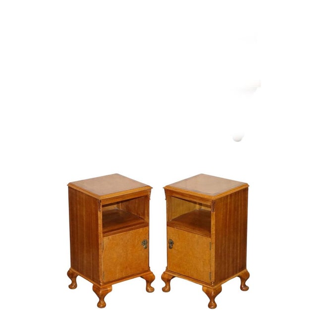A beautiful antique pair of Art Deco 1920s nightstands / bedside tables, crafted in light walnut with elegant proportions...