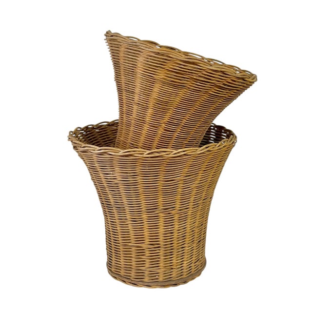 The most charming pair of fluted baskets that nest perfectly together. Beautiful hand made detailing around the rims and...