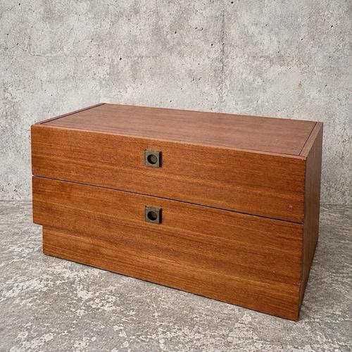 A compact mid-century two-drawer chest by g plan, with warm-toned timber and attractive natural grain throughout. Two...