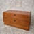 A compact mid-century two-drawer chest by g plan, with warm-toned timber and attractive natural grain throughout. Two...