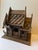 A single antique teak wood Thai spirit house model.
